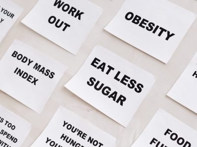 Collection of motivational notes promoting health and wellness found on paper notes.